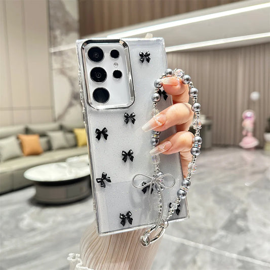 Cute Bowknot Bracelet Transparent Case for Samsung Galaxy S24/S23/S22 Series & A15/A16/A25/A35/A55/A13 – Wrist Chain TPU Cover with Beads